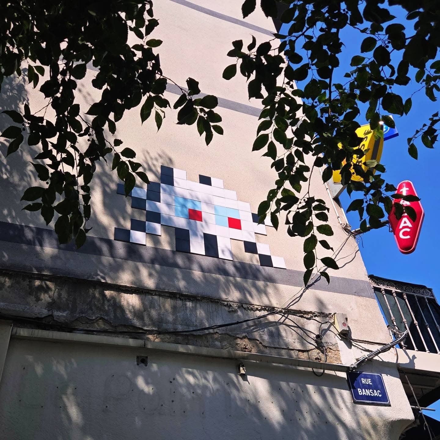 Photo by Invades your space on July 31, 2026. May be pop art of skull, telephone pole, brick wall and text.