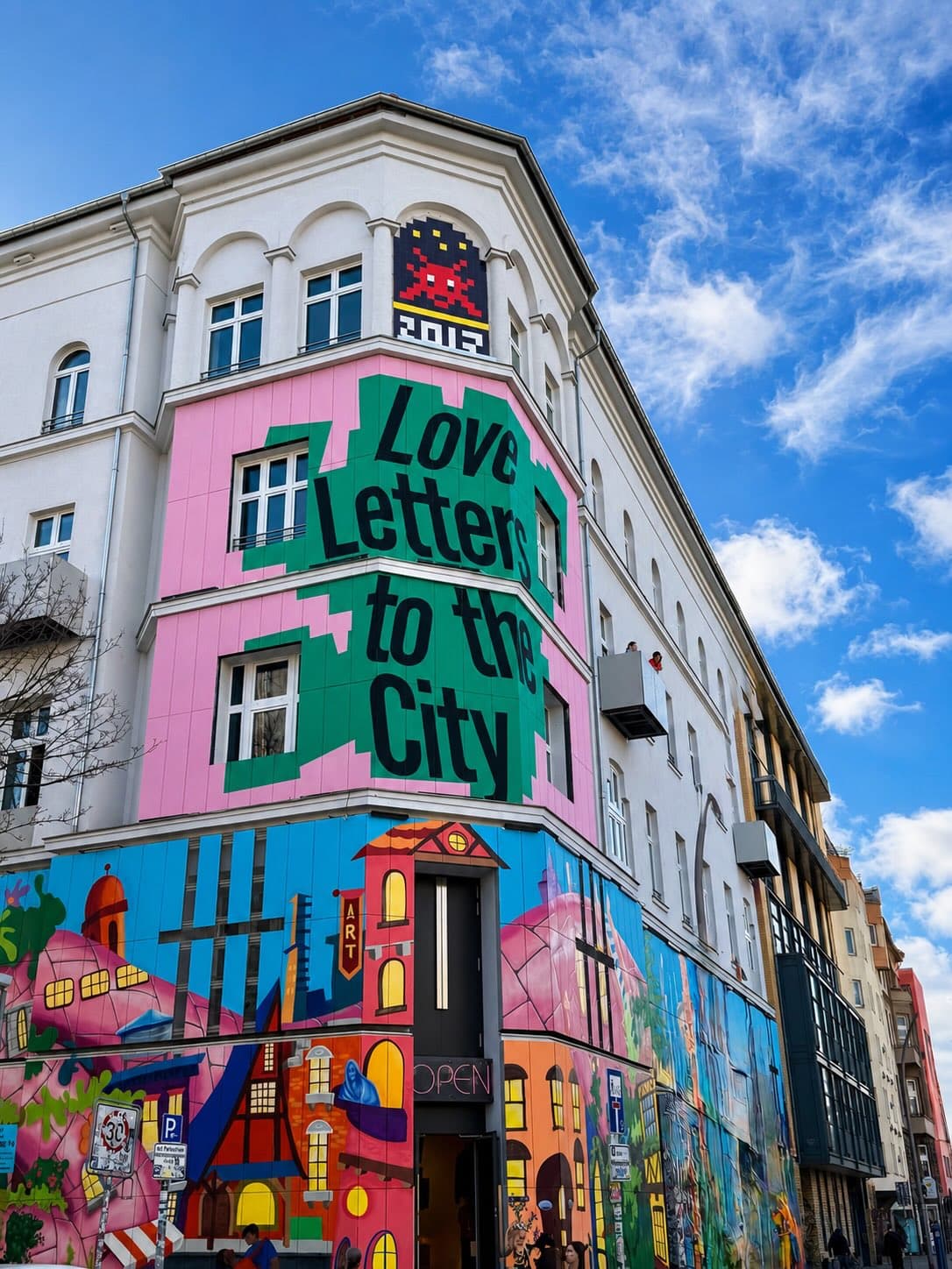 Photo by @invadicted on June 28, 2026. May be pop art of street, buildings and text that says '고미귀 Love Letten 주 4to toth the City 丹 ત 番 時 ETA'.